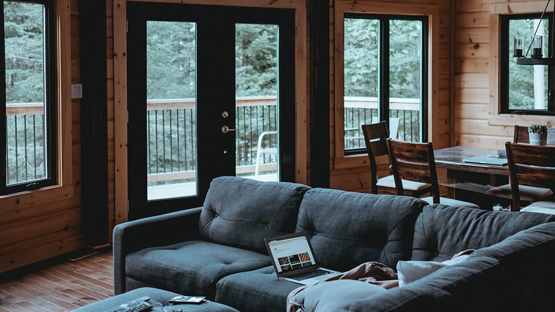 laptop on couch with beautiful view